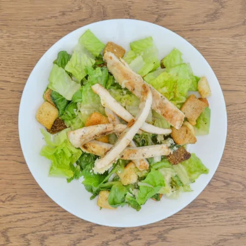 Chicken Caesar Salad - Fresh Caesar salad topped with grilled chicken.