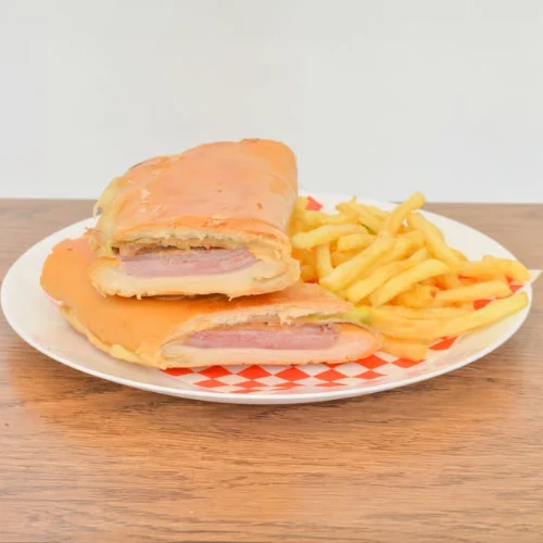 Cuban Sandwich - Classic Cuban sandwich with ham, pork leg, cheese, and pickles.